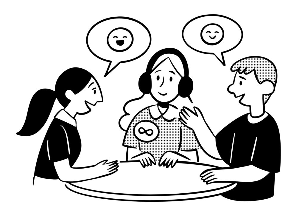 Three people communicating happily around a table.